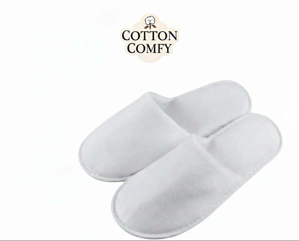 White bathroom slippers with 'Cotton Comfy' branding on a white background
